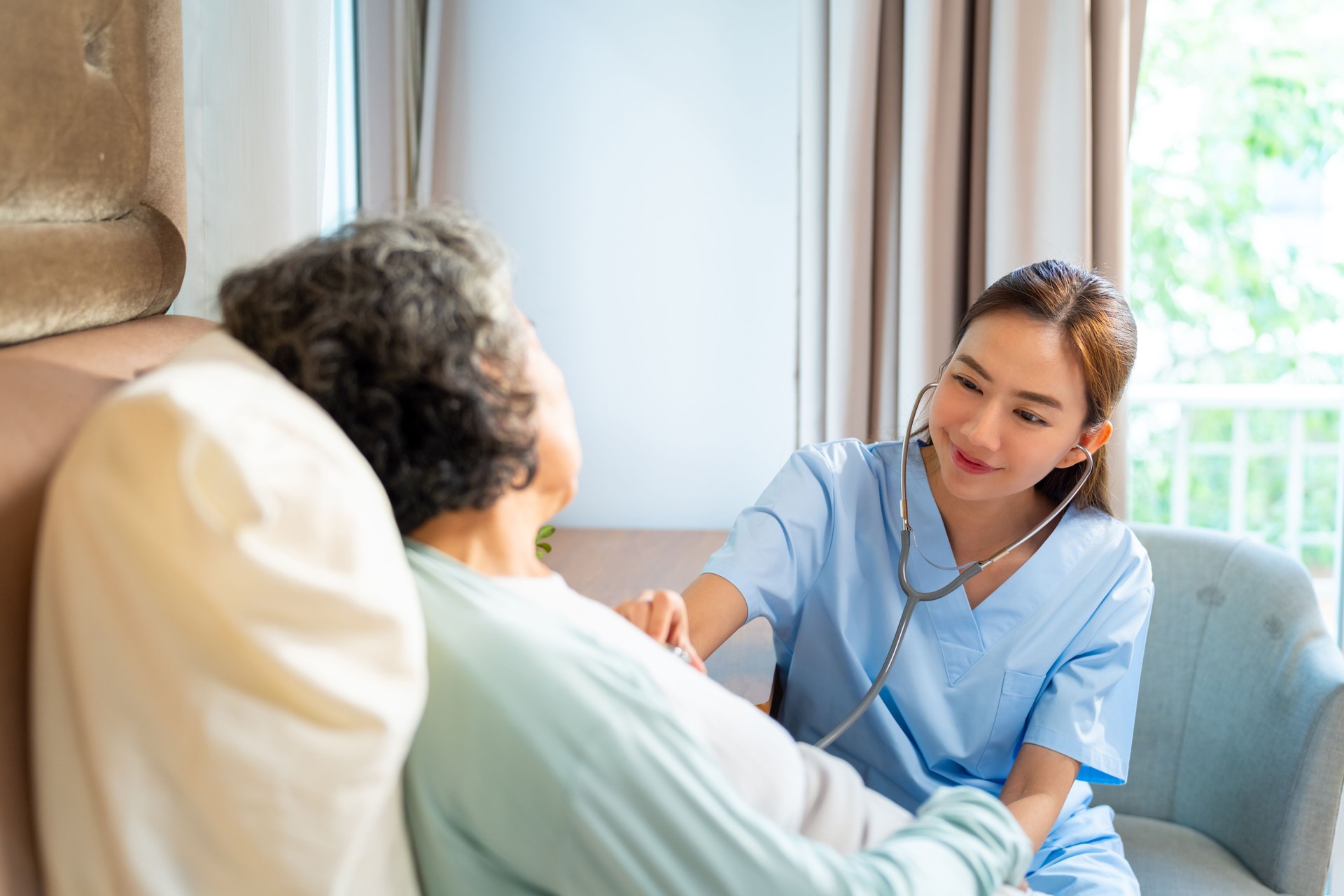 Doctor examine senior patient at home.