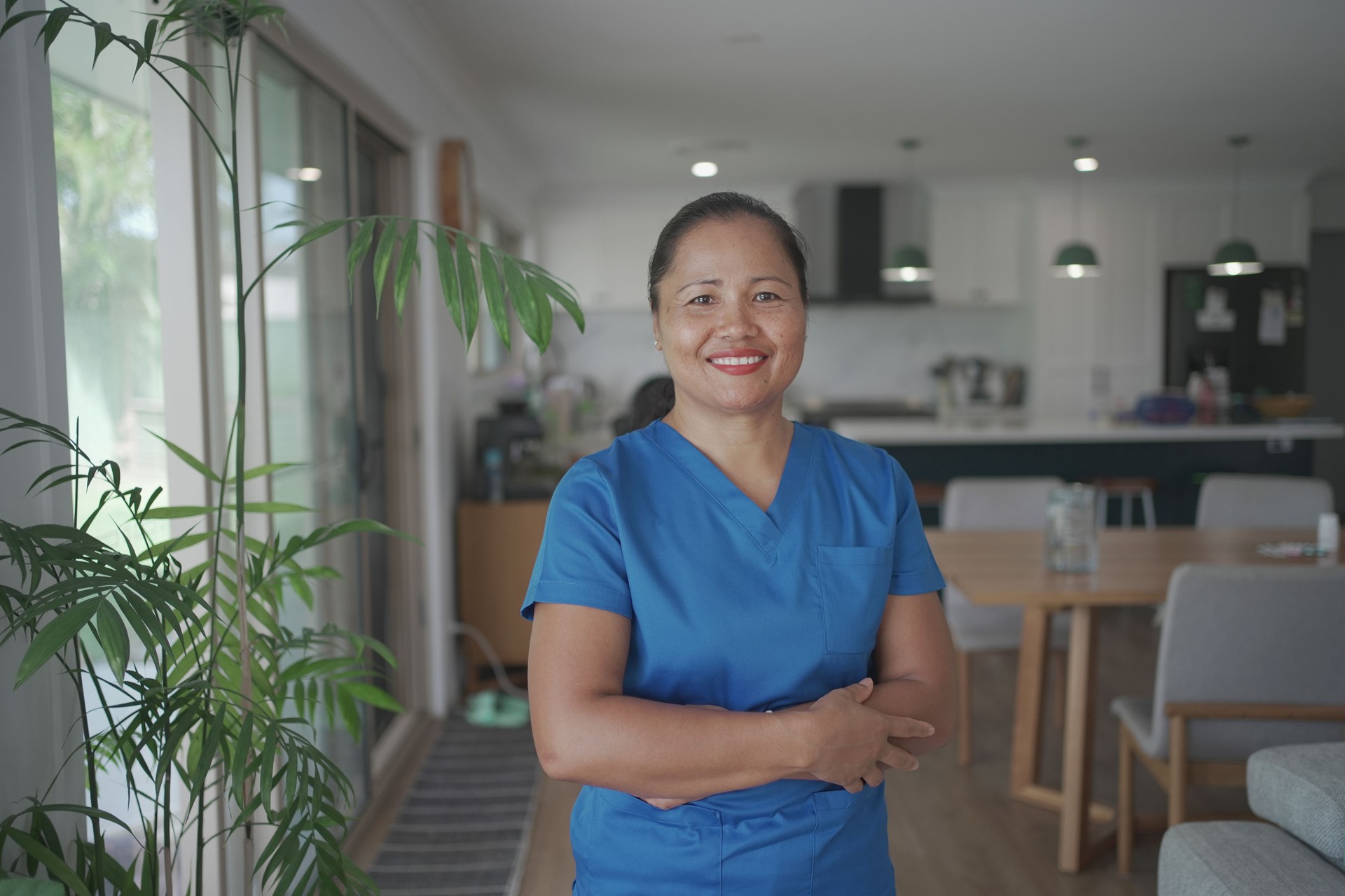 Asian health care worker visiting elderly woman at home, home nurse, home care service concept